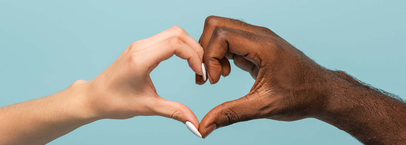 hands forming showing heart gesture isolated on blue, panoramic shot