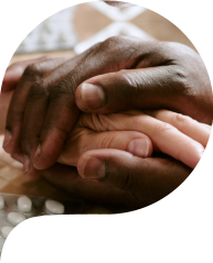 Couple Comforting Each Other While Holding Hands at Table