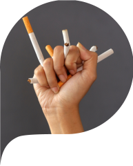 Hand crushing cigarettes. Concept of quitting smoking